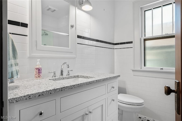 159 Edgerton Rd, Akron, OH 44303 - bathroom featuring tile walls and vanity