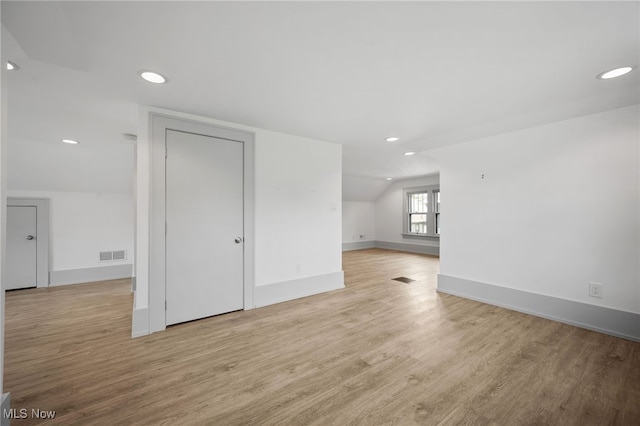 159 Edgerton Rd, Akron, OH 44303 - unfurnished living room featuring light wood finished floors, vaulted ceiling, and recessed lighting