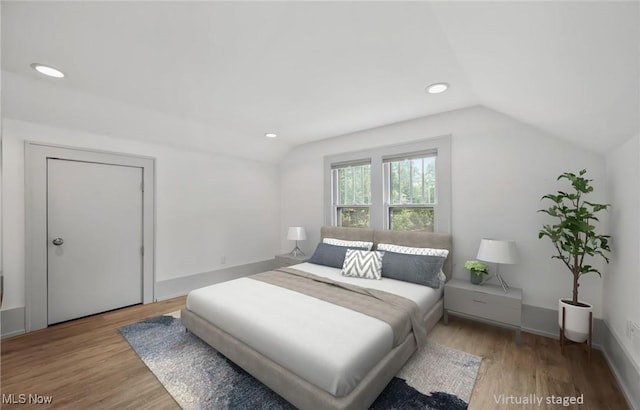 159 Edgerton Rd, Akron, OH 44303 - bedroom with vaulted ceiling, wood finished floors, and recessed lighting