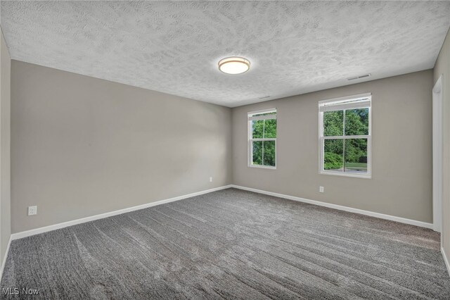 301 Karson Dr, Akron, OH 44312 - carpeted spare room with a textured ceiling and baseboards