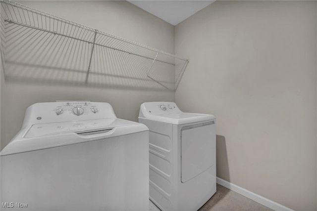 301 Karson Dr, Akron, OH 44312 - laundry area featuring washing machine and clothes dryer and tile patterned flooring