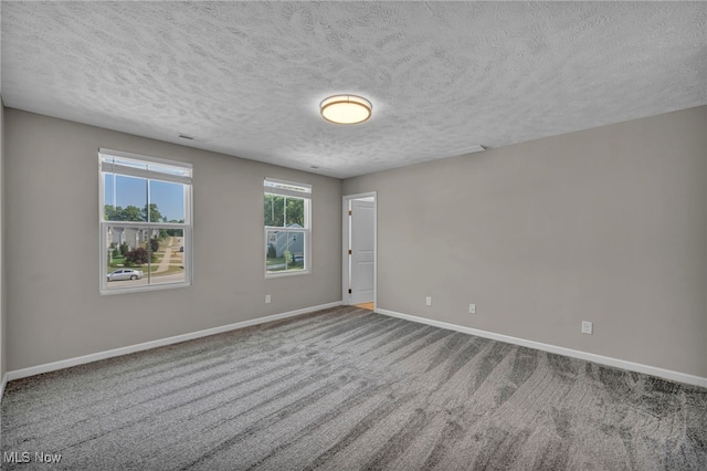 301 Karson Dr, Akron, OH 44312 - empty room with carpet flooring and a textured ceiling