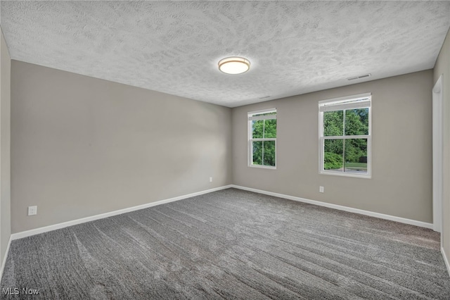 301 Karson Dr, Akron, OH 44312 - spare room featuring a textured ceiling and carpet floors