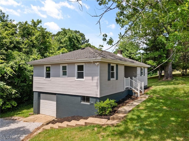 60880 Webb Heights Rd, Shadyside, OH 43947 - view of home's exterior featuring a chimney, a yard, a garage, gravel driveway, and a shingled roof