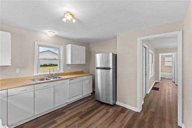 60880 Webb Heights Rd, Shadyside, OH 43947 - kitchen featuring freestanding refrigerator, dishwasher, dark wood-type flooring, and light countertops