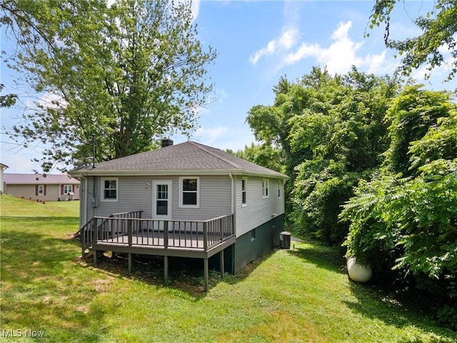 60880 Webb Heights Rd, Shadyside, OH 43947 - back of property with a lawn, a deck, a chimney, and roof with shingles