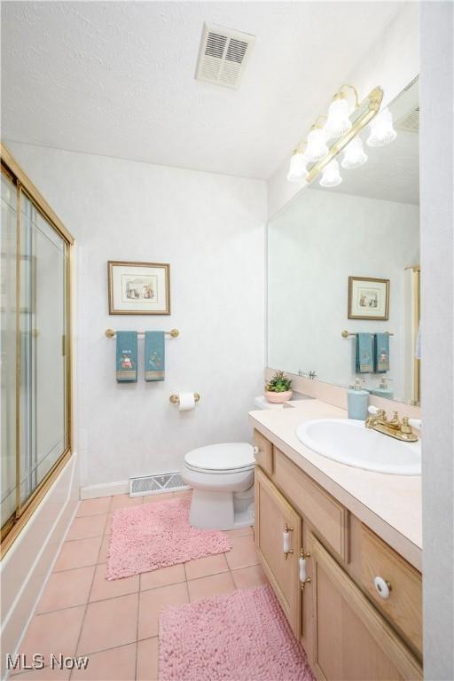 3043 E Wallings Rd, Broadview Heights, OH 44147 - full bathroom featuring vanity, tile patterned floors, and bath / shower combo with glass door
