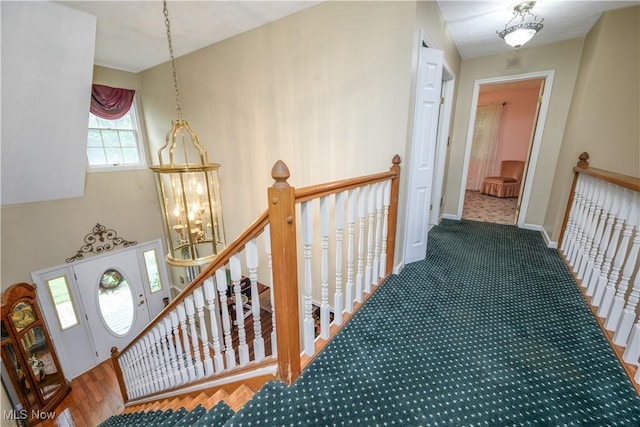 3043 E Wallings Rd, Broadview Heights, OH 44147 - hallway with an upstairs landing and a chandelier