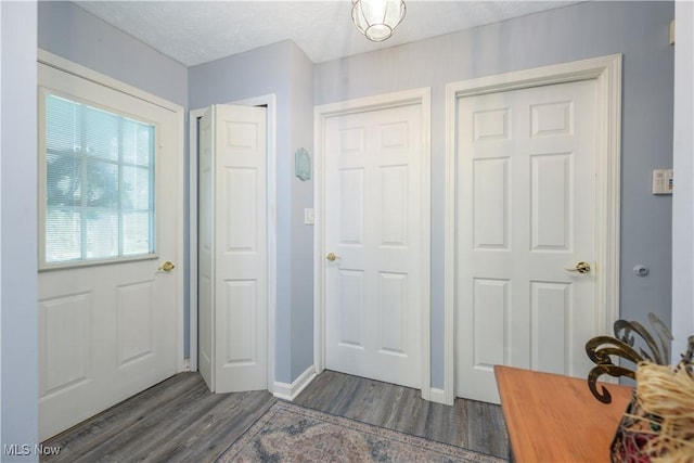 3043 E Wallings Rd, Broadview Heights, OH 44147 - entryway featuring dark wood-style floors and a textured ceiling