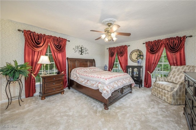 3043 E Wallings Rd, Broadview Heights, OH 44147 - bedroom with light colored carpet, ceiling fan, wallpapered walls, and access to exterior