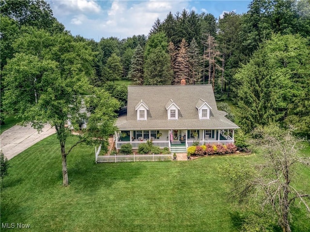 3043 E Wallings Rd, Broadview Heights, OH 44147 - view of front of home featuring a porch, a front lawn, and a forest view