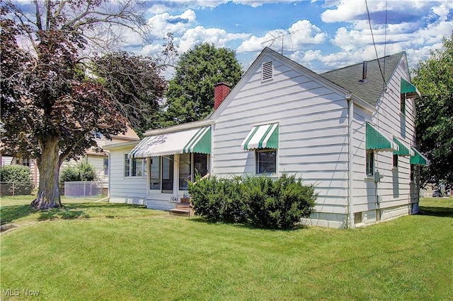 1648 Frederick Ave SW, Canton, OH 44706 - back of property featuring a chimney and a shingled roof