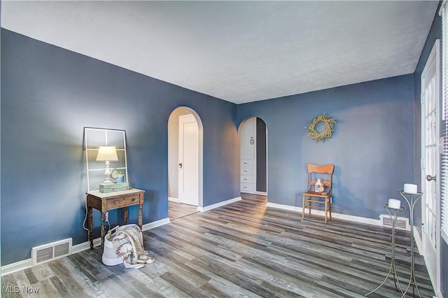 1648 Frederick Ave SW, Canton, OH 44706 - spare room with arched walkways and wood finished floors