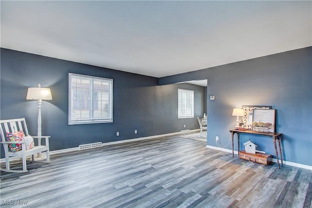 1648 Frederick Ave SW, Canton, OH 44706 - unfurnished living room with wood finished floors and baseboards