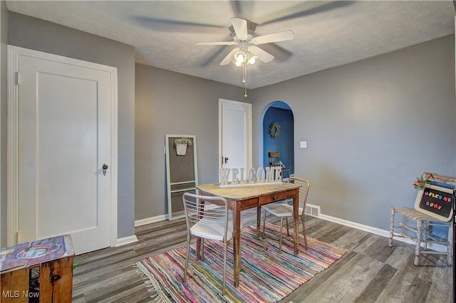 1648 Frederick Ave SW, Canton, OH 44706 - home office with arched walkways, wood finished floors, and ceiling fan