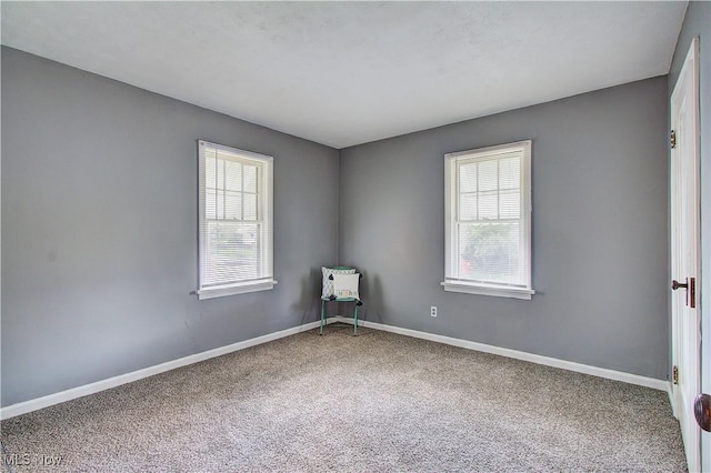 1648 Frederick Ave SW, Canton, OH 44706 - spare room with carpet floors and baseboards