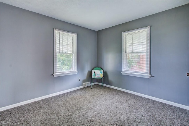 1648 Frederick Ave SW, Canton, OH 44706 - carpeted empty room featuring baseboards
