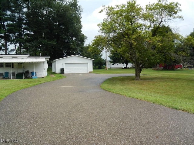 21467 Sr 751, West Lafayette, OH 43845 - view of front of property with an outbuilding, a front lawn, and a detached garage