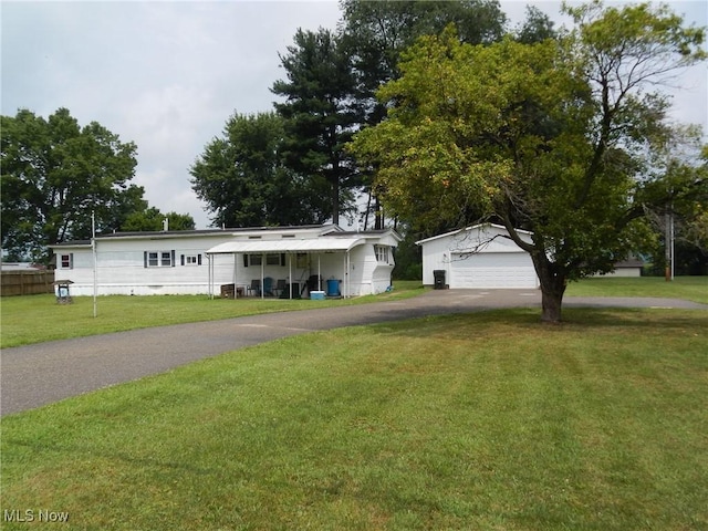 21467 Sr 751, West Lafayette, OH 43845 - view of front of property with a front yard, an outdoor structure, and driveway