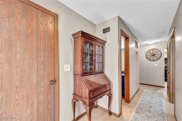 255 Portage Lakes Dr Unit E, Akron, OH 44319 - hall featuring baseboards and light tile patterned floors