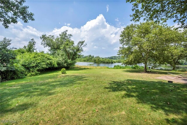 255 Portage Lakes Dr Unit E, Akron, OH 44319 - view of green lawn featuring a water view