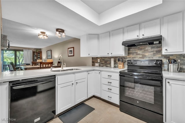 255 Portage Lakes Dr Unit E, Akron, OH 44319 - kitchen featuring black appliances, under cabinet range hood, light countertops, and backsplash