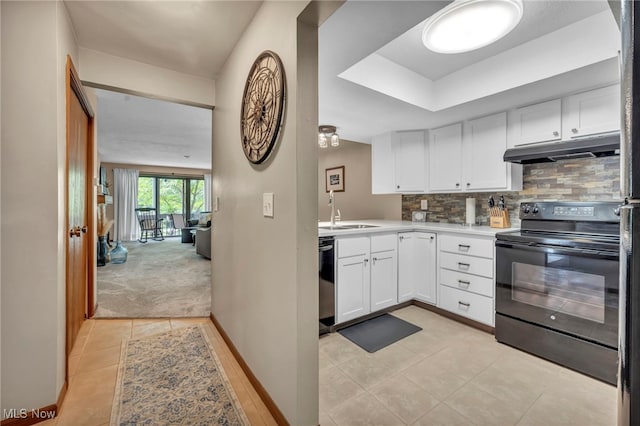 255 Portage Lakes Dr Unit E, Akron, OH 44319 - kitchen with black electric range, under cabinet range hood, dishwasher, white cabinetry, and light countertops