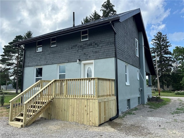 26 E Satin St, Jefferson, OH 44047 - back of property featuring stucco siding and a deck