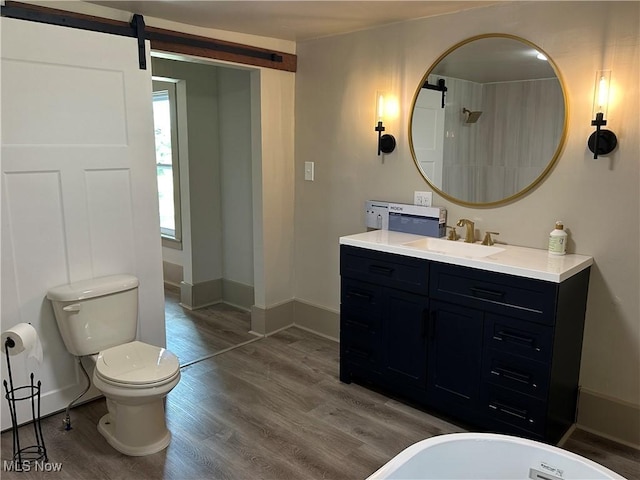 26 E Satin St, Jefferson, OH 44047 - bathroom featuring vanity and wood finished floors