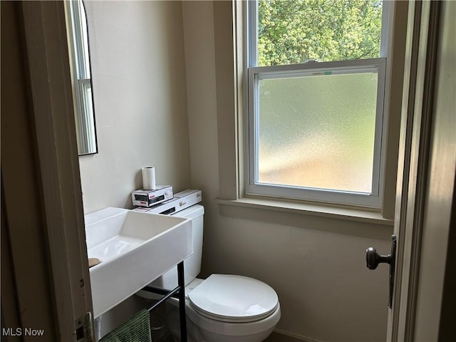 26 E Satin St, Jefferson, OH 44047 - half bathroom featuring toilet and a sink