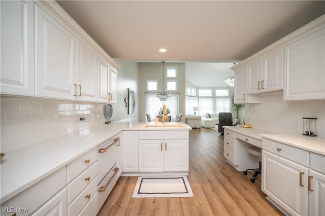 117 Nicklaus Dr NE, Warren, OH 44484 - kitchen with recessed lighting, white cabinetry, built in desk, a peninsula, and light wood-style flooring