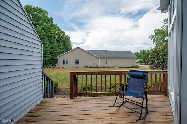 117 Nicklaus Dr NE, Warren, OH 44484 - wooden deck featuring a lawn