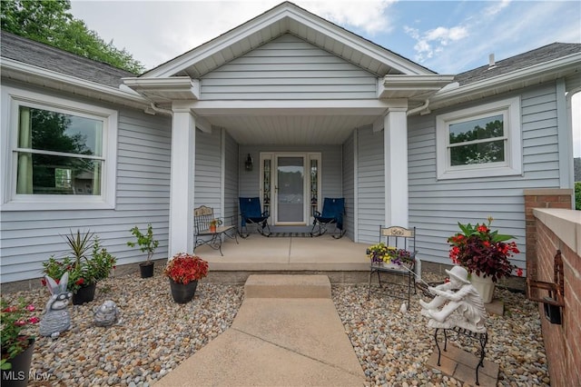 117 Nicklaus Dr NE, Warren, OH 44484 - view of exterior entry with a porch