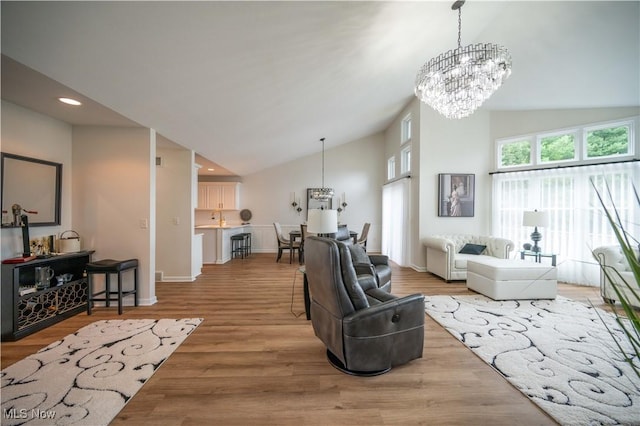 117 Nicklaus Dr NE, Warren, OH 44484 - living area with a chandelier, wood finished floors, high vaulted ceiling, and recessed lighting