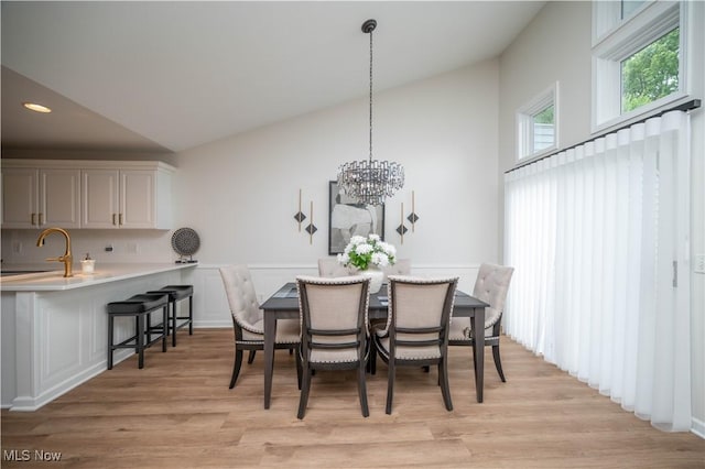 117 Nicklaus Dr NE, Warren, OH 44484 - dining area featuring light wood-style floors, a chandelier, recessed lighting, and high vaulted ceiling