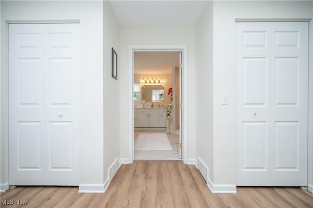 117 Nicklaus Dr NE, Warren, OH 44484 - hallway with light wood-style flooring
