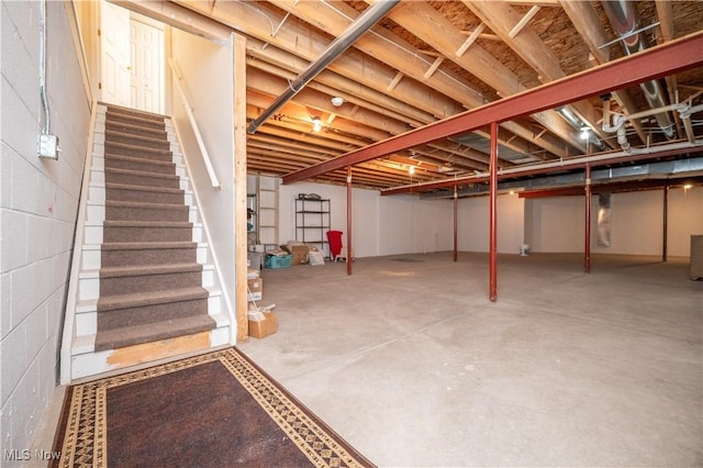 117 Nicklaus Dr NE, Warren, OH 44484 - basement featuring stairway and concrete block wall