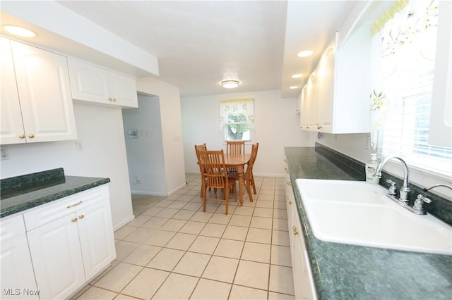 110 Wendt Way, Follansbee, WV 26037 - kitchen with white cabinetry, dark countertops, light tile patterned flooring, and recessed lighting