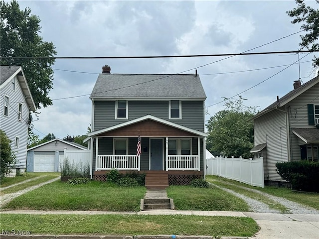 667 Eastland Ave, Akron, OH 44305 - traditional style home featuring driveway, a porch, a chimney, a garage, and an outdoor structure