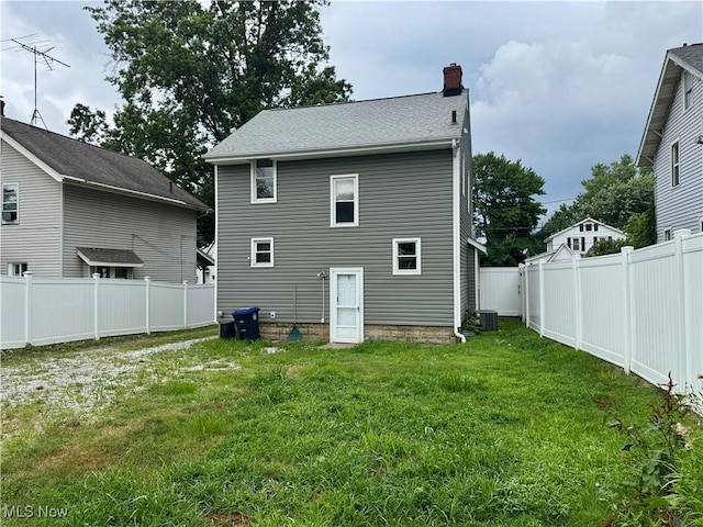 667 Eastland Ave, Akron, OH 44305 - rear view of house with a chimney and a fenced backyard