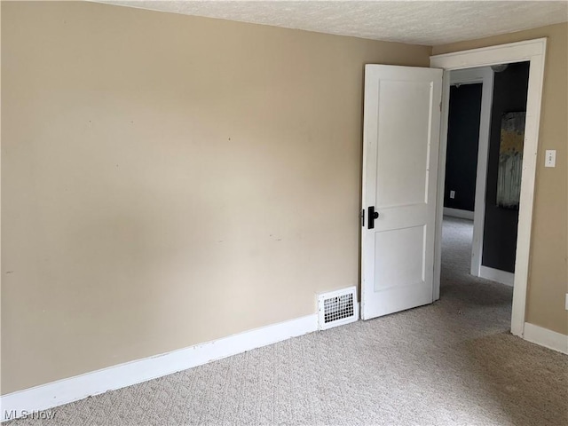 667 Eastland Ave, Akron, OH 44305 - carpeted spare room featuring baseboards and a textured ceiling