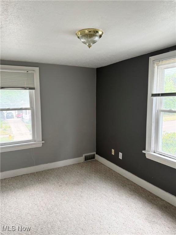 667 Eastland Ave, Akron, OH 44305 - carpeted spare room with plenty of natural light
