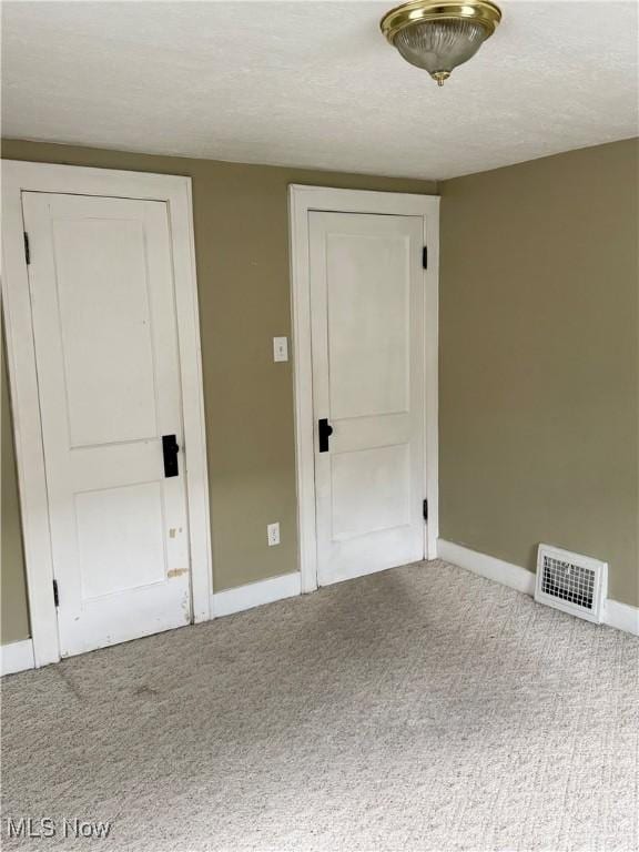 667 Eastland Ave, Akron, OH 44305 - carpeted empty room featuring baseboards and a textured ceiling