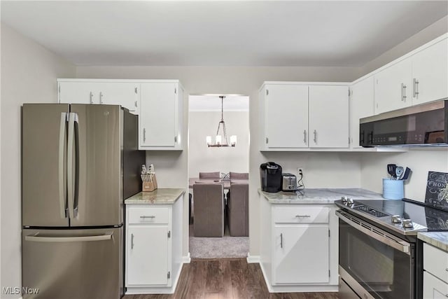 1851 King James Unit 322, Westlake, OH 44145 - kitchen featuring stainless steel appliances, dark wood-type flooring, white cabinets, and light countertops