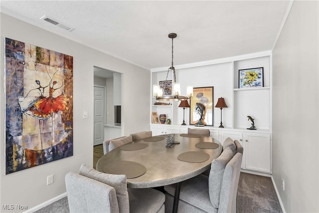 1851 King James Unit 322, Westlake, OH 44145 - dining area featuring dark carpet and a chandelier