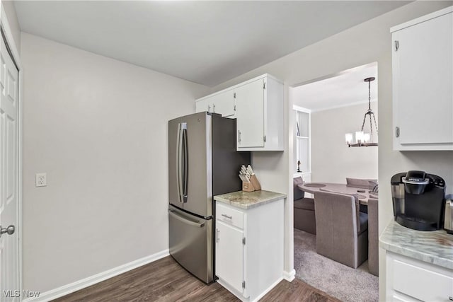 1851 King James Unit 322, Westlake, OH 44145 - kitchen featuring freestanding refrigerator, dark wood finished floors, white cabinetry, and light countertops
