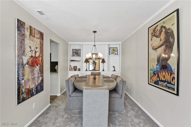 1851 King James Unit 322, Westlake, OH 44145 - carpeted dining room featuring a chandelier and built in features