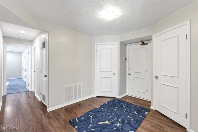 1851 King James Unit 322, Westlake, OH 44145 - entryway featuring wood finished floors and a textured ceiling