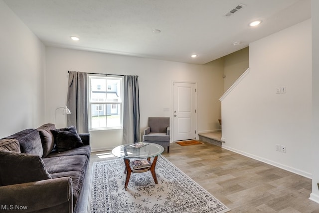 677 Crossings Ln, Akron, OH 44320 - living area with light wood-style floors, recessed lighting, and stairs
