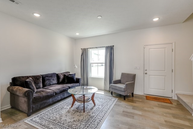 677 Crossings Ln, Akron, OH 44320 - living room with light wood-type flooring and recessed lighting